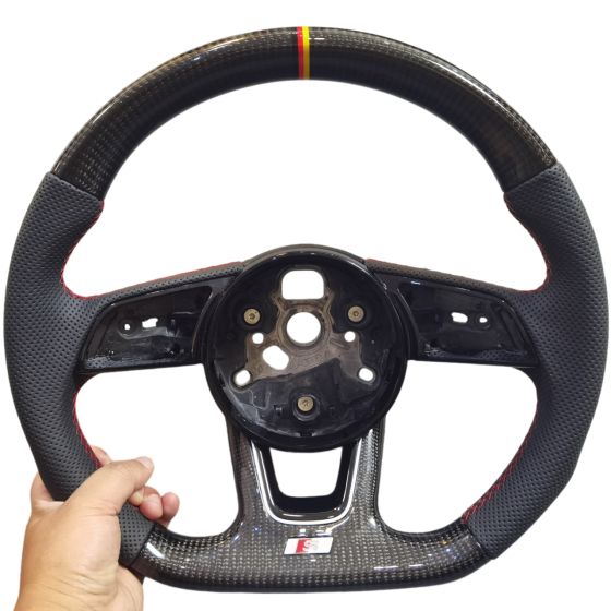 Audi B9 S-line carbon fiber steering wheel with red stitching and German flag center mark